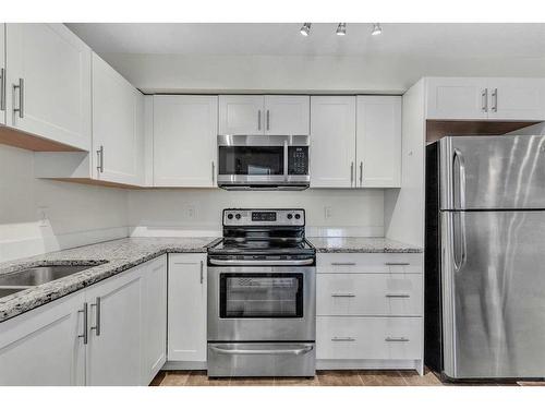 4211-755 Copperpond Boulevard Se, Calgary, AB - Indoor Photo Showing Kitchen With Stainless Steel Kitchen