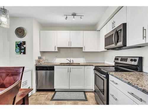 4211-755 Copperpond Boulevard Se, Calgary, AB - Indoor Photo Showing Kitchen With Stainless Steel Kitchen With Double Sink