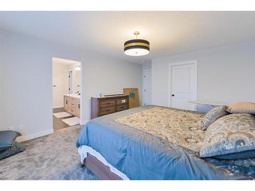 153 Cranbrook Cove Se, Calgary, AB - Indoor Photo Showing Bedroom