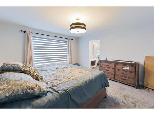 153 Cranbrook Cove Se, Calgary, AB - Indoor Photo Showing Bedroom