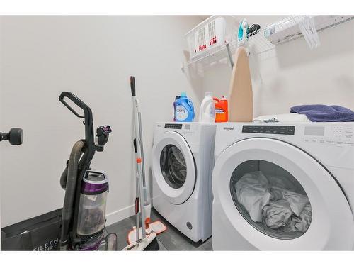 153 Cranbrook Cove Se, Calgary, AB - Indoor Photo Showing Laundry Room