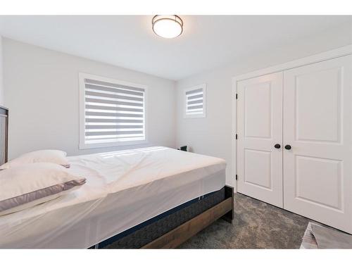 153 Cranbrook Cove Se, Calgary, AB - Indoor Photo Showing Bedroom