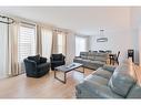 153 Cranbrook Cove Se, Calgary, AB  - Indoor Photo Showing Living Room 