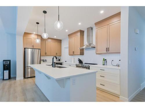 153 Cranbrook Cove Se, Calgary, AB - Indoor Photo Showing Kitchen With Double Sink With Upgraded Kitchen