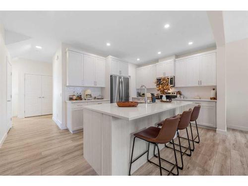 256 Willow Corner, Cochrane, AB - Indoor Photo Showing Kitchen With Upgraded Kitchen