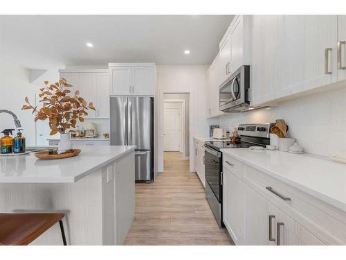 256 Willow Corner, Cochrane, AB - Indoor Photo Showing Kitchen With Upgraded Kitchen