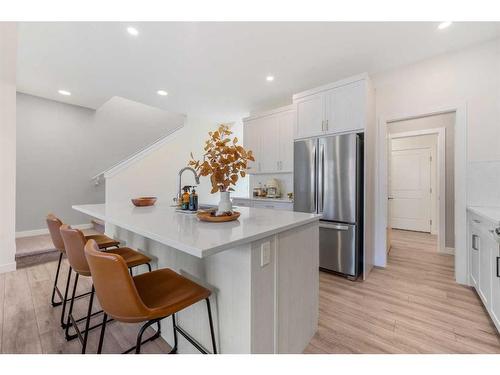 256 Willow Corner, Cochrane, AB - Indoor Photo Showing Kitchen With Upgraded Kitchen