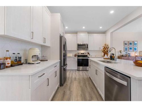 256 Willow Corner, Cochrane, AB - Indoor Photo Showing Kitchen With Double Sink With Upgraded Kitchen