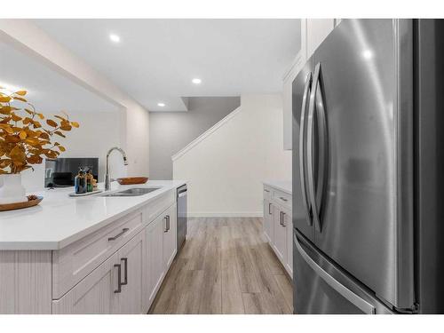 256 Willow Corner, Cochrane, AB - Indoor Photo Showing Kitchen With Double Sink