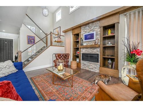 201 Kinniburgh Cove, Chestermere, AB - Indoor Photo Showing Living Room With Fireplace