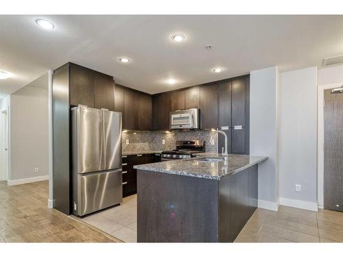 1107-99 Spruce Place Sw, Calgary, AB - Indoor Photo Showing Kitchen With Stainless Steel Kitchen With Upgraded Kitchen