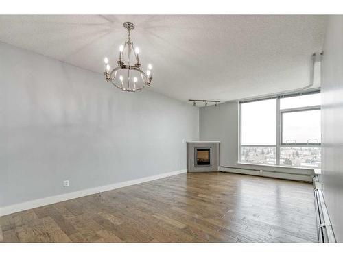 1107-99 Spruce Place Sw, Calgary, AB - Indoor With Fireplace