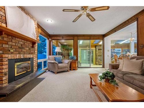 14108 Park Estates Drive Se, Calgary, AB - Indoor Photo Showing Living Room With Fireplace