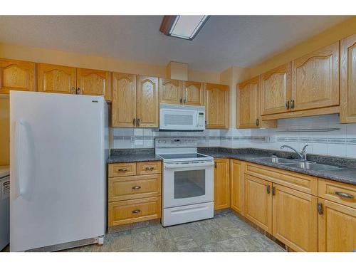 182 Riverview Point Se, Calgary, AB - Indoor Photo Showing Kitchen With Double Sink