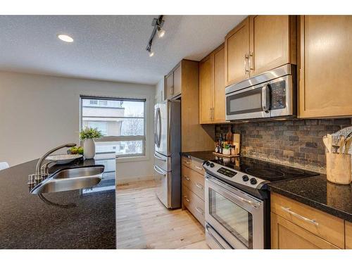 10 Aspen Hills Terrace Sw, Calgary, AB - Indoor Photo Showing Kitchen With Stainless Steel Kitchen With Double Sink