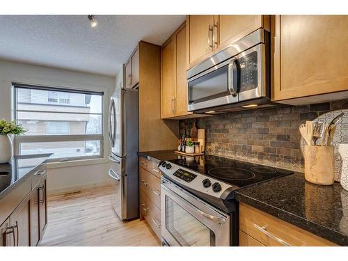 10 Aspen Hills Terrace Sw, Calgary, AB - Indoor Photo Showing Kitchen With Stainless Steel Kitchen