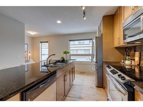 10 Aspen Hills Terrace Sw, Calgary, AB - Indoor Photo Showing Kitchen With Stainless Steel Kitchen With Double Sink