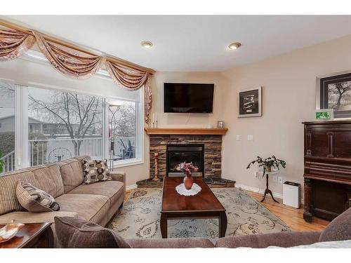 6007 60 Street, Olds, AB - Indoor Photo Showing Living Room With Fireplace