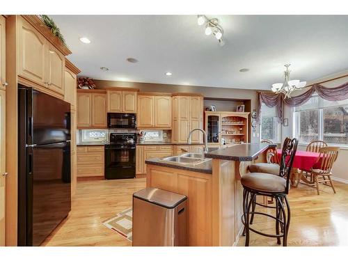 6007 60 Street, Olds, AB - Indoor Photo Showing Kitchen With Double Sink