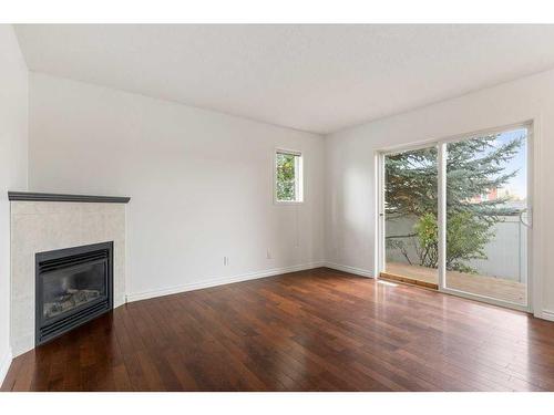 501-760 Railway Gate Sw, Airdrie, AB - Indoor Photo Showing Living Room With Fireplace