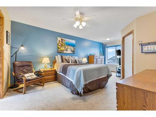 266 Rocky Ridge Bay Nw, Calgary, AB - Indoor Photo Showing Bedroom