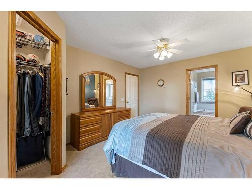 266 Rocky Ridge Bay Nw, Calgary, AB - Indoor Photo Showing Bedroom