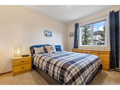 266 Rocky Ridge Bay Nw, Calgary, AB - Indoor Photo Showing Bedroom