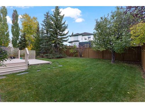 266 Rocky Ridge Bay Nw, Calgary, AB - Outdoor With Backyard