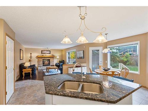 266 Rocky Ridge Bay Nw, Calgary, AB - Indoor Photo Showing Kitchen With Double Sink