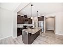 298 Kingfisher Crescent Se, Airdrie, AB  - Indoor Photo Showing Kitchen With Stainless Steel Kitchen With Double Sink With Upgraded Kitchen 