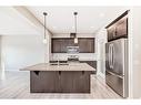 298 Kingfisher Crescent Se, Airdrie, AB  - Indoor Photo Showing Kitchen With Stainless Steel Kitchen With Upgraded Kitchen 