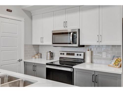 35-230 Seton Passage Se, Calgary, AB - Indoor Photo Showing Kitchen With Double Sink With Upgraded Kitchen