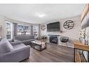 245 Evermeadow Avenue Sw, Calgary, AB  - Indoor Photo Showing Living Room With Fireplace 