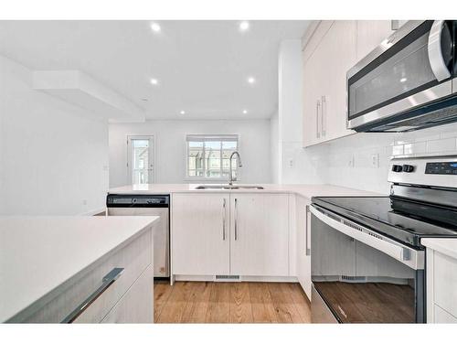 661 Savanna Boulevard Ne, Calgary, AB - Indoor Photo Showing Kitchen With Double Sink