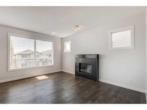 118 Panora Court Nw, Calgary, AB - Indoor Photo Showing Living Room With Fireplace