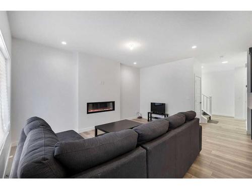 24 Cornerbrook Road Ne, Calgary, AB - Indoor Photo Showing Living Room With Fireplace