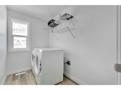 24 Cornerbrook Road Ne, Calgary, AB - Indoor Photo Showing Laundry Room