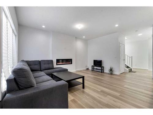 24 Cornerbrook Road Ne, Calgary, AB - Indoor Photo Showing Living Room With Fireplace