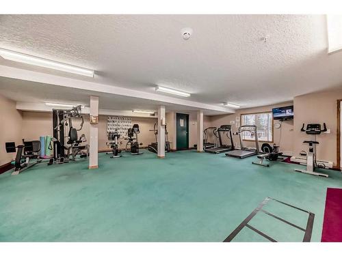 111-7239 Sierra Morena Boulevard Sw, Calgary, AB - Indoor Photo Showing Gym Room