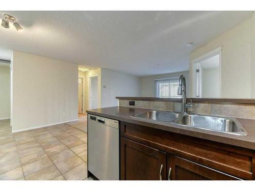 4204-115 Prestwick Villas Se, Calgary, AB - Indoor Photo Showing Kitchen With Double Sink