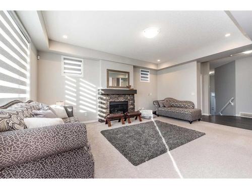 59 Cityside Common Ne, Calgary, AB - Indoor Photo Showing Bedroom With Fireplace