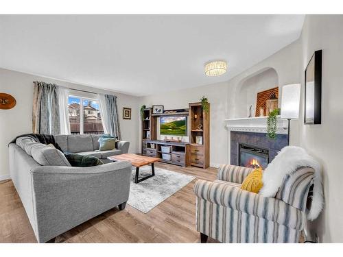 132 Springmere Grove, Chestermere, AB - Indoor Photo Showing Living Room With Fireplace