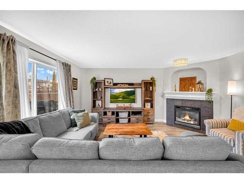 132 Springmere Grove, Chestermere, AB - Indoor Photo Showing Living Room With Fireplace