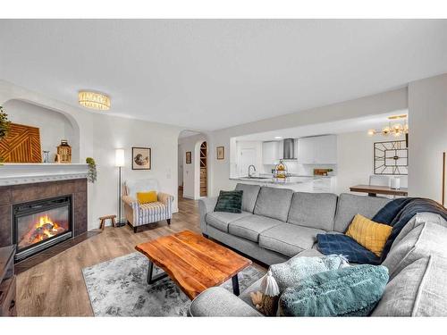 132 Springmere Grove, Chestermere, AB - Indoor Photo Showing Living Room With Fireplace