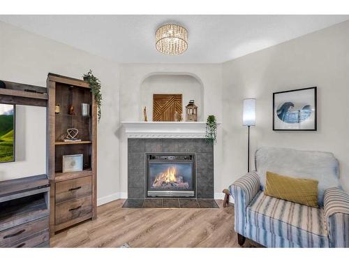 132 Springmere Grove, Chestermere, AB - Indoor Photo Showing Living Room With Fireplace