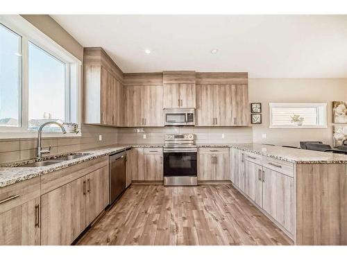 60 Reunion Loop Nw, Airdrie, AB - Indoor Photo Showing Kitchen With Double Sink