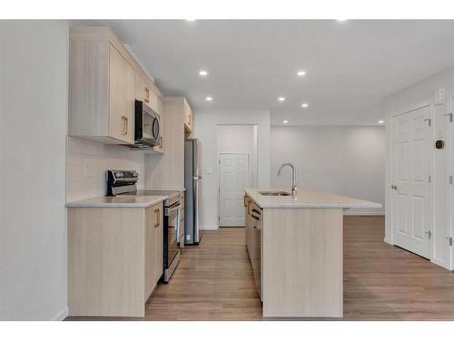 1013 Southwinds Green Sw, Airdrie, AB - Indoor Photo Showing Kitchen