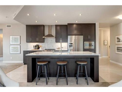 204-145 Burma Star Road Sw, Calgary, AB - Indoor Photo Showing Kitchen With Stainless Steel Kitchen With Upgraded Kitchen