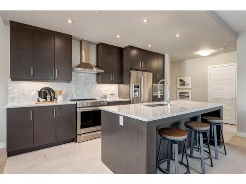 204-145 Burma Star Road Sw, Calgary, AB - Indoor Photo Showing Kitchen With Stainless Steel Kitchen With Upgraded Kitchen