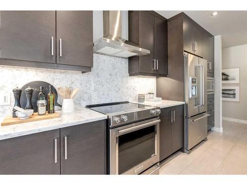 204-145 Burma Star Road Sw, Calgary, AB - Indoor Photo Showing Kitchen With Stainless Steel Kitchen With Upgraded Kitchen